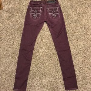 Burgundy Rock Revival skinny jeans